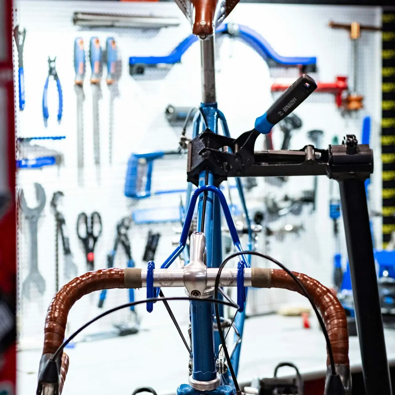 a bike with a lot of tools on the back of it